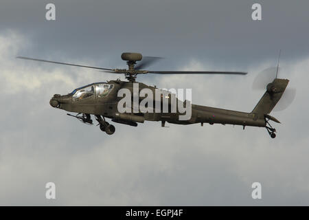Army Air Corps Apache AH1 Attack helicopter flies in storm clouds on a training flight. Stock Photo