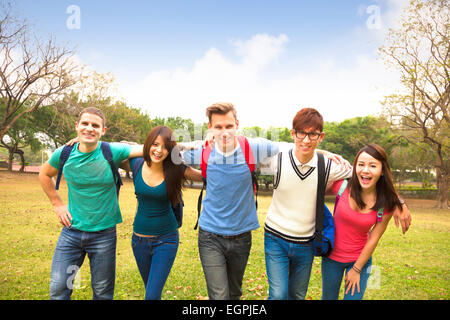 Happy group of students walking together Stock Photo