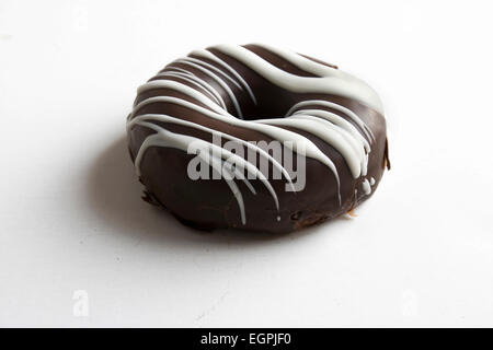 Donuts, covered in black and white chocolate on isolated background Stock Photo