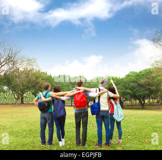 Happy young group of students watching the sky Stock Photo