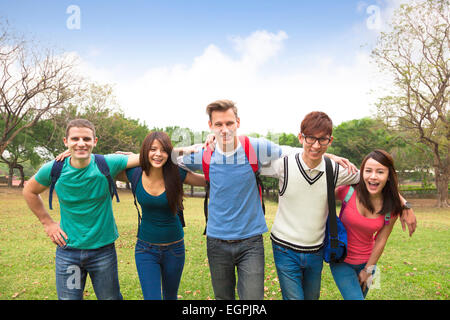 Happy group of students walking together Stock Photo