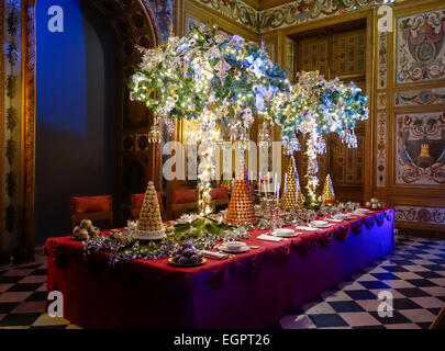 Christmas decorations at Chateau de Vaux-le-Vicomte, Maincy, Paris. Table setting for King's dinner, with Laduree macarons Stock Photo