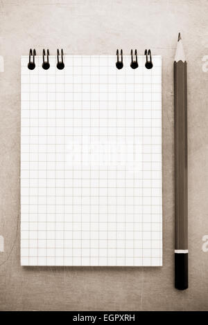 checked notebook at metal background texture Stock Photo
