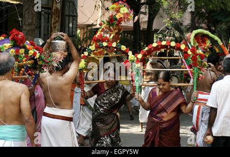 Hindu devotees take procession of lord Subramanya swamy in the streets with murugan kavadi in Hyderabad,India on April 13,2014. Stock Photo