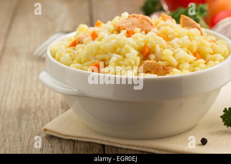 bowl full of rice on wooden background Stock Photo