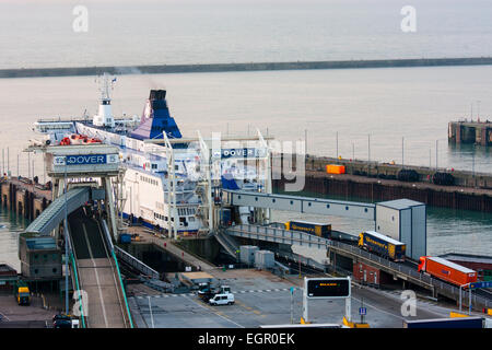 Dawn high angle view from the cliffs of the car ferry terminal at Dover docks in the UK. Car ferry at embarkation point six with lorries boarding. Stock Photo