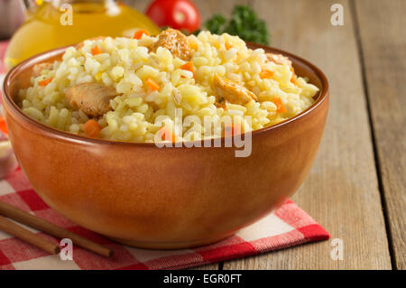 bowl full of rice on wooden background Stock Photo