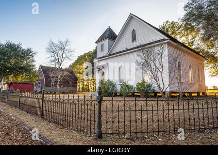 Old church and homes in the historic landmark park near Dothan, Alabama Stock Photo