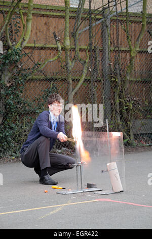 UK school science demonstration of a hydrogen/oxygen rocket being lit by a teacher Stock Photo