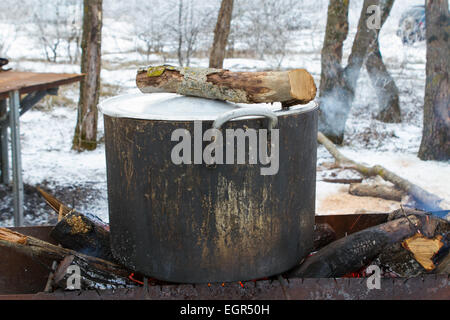 shurpa - soup with meat and potato on the fire Stock Photo