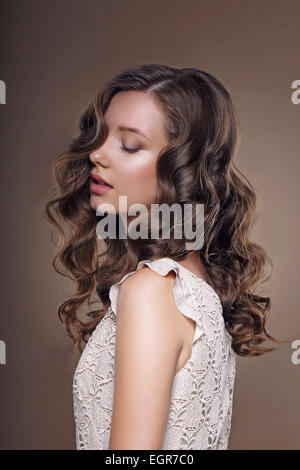 Studio Portrait of Young Dreamy Brunette with Closed Eyes Stock Photo