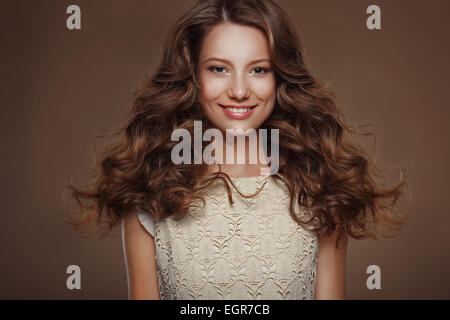 Beautiful Happy Brunette with Long Curly Hairs Stock Photo