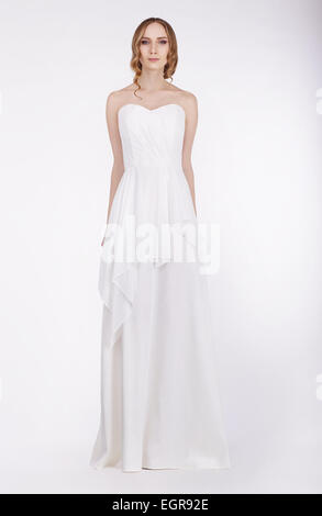Fashion Model Standing in Long White Dress Stock Photo