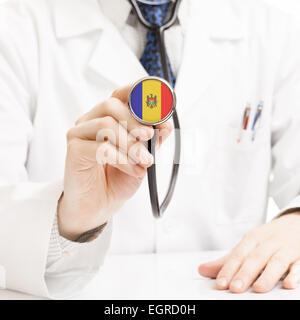 Doctor holding stethoscope with flag series - Moldova Stock Photo