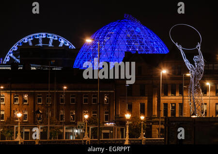 'Beacon of Hope' statue at Thanksgiving Square, with the dome of Victoria Square and a ferris wheel in the background Stock Photo