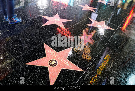 Hollywood Boulevard, Los Angeles. Hollywood Walk of Fame with neon lights reflecting on the wet street. Stock Photo