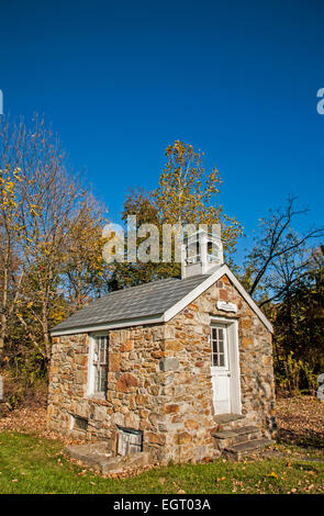 Historic Perryville one room schoolhouse exterior and autumn trees in Hunterdon County, New Jersey, USA school house, US schools United States Stock Photo