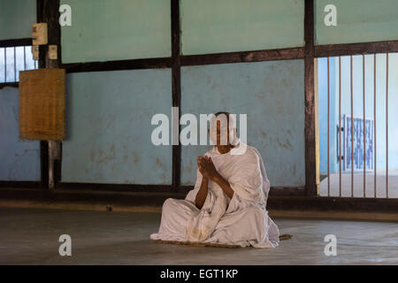 Old Monk Praying, Uttar Kamalabari Satra, Majuli Island Stock Photo