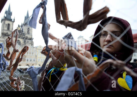 Prague, Czech Republic. 1st Mar, 2015. Tens of people today attended a rally, staged by the Prague Maidan group, that honoured the memory of Russian opposition leader Boris Nemtsov who was murdered in the centre of Moscow on Friday. They made a camouflage net for Ukraine army at the Old Town Square, in Prague, Czech Republic, on Sunday, March 1, 2015. © Michal Kamaryt/CTK Photo/Alamy Live News Stock Photo