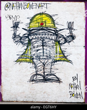 Graffiti of a builder wearing a hard hat and high-vis jacket, by Nathan Bowen, in Fenchurch Street, City of London, UK Stock Photo