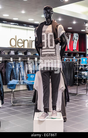 Shop Mannequin  in a clothes shop showing latest fashionable trends and styles in the clothing sector. Stock Photo