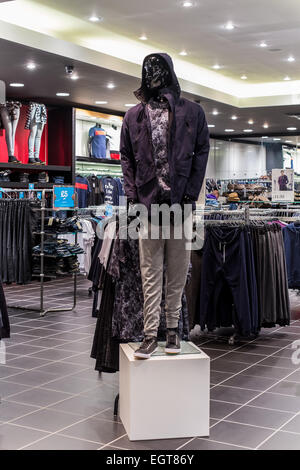 Shop Mannequin  in a clothes shop showing latest fashionable trends and styles in the clothing sector. Stock Photo