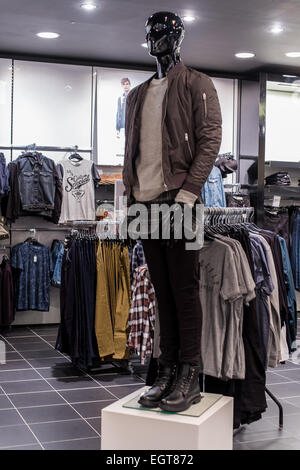 Shop Mannequin  in a clothes shop showing latest fashionable trends and styles in the clothing sector. Stock Photo