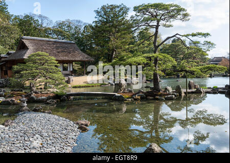 Kyoto, Japan. The gardens of the Katsura Imperial Villa (Katsura Rikyu). The pond in spring, with the Shokin-tei tea house Stock Photo