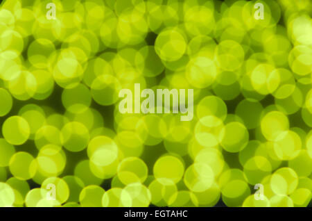 Festive colored glowing abstract circular bokeh yellow green background. Best for greeting card, web  banner. Stock Photo