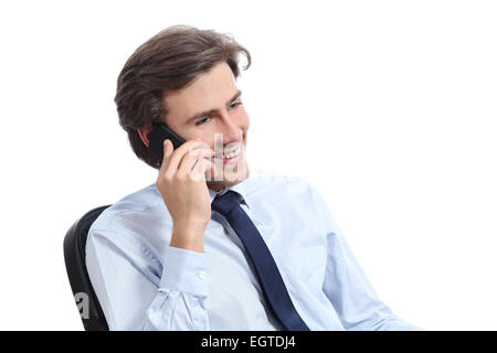 Happy sitting businessman working on the phone isolated on a white background Stock Photo