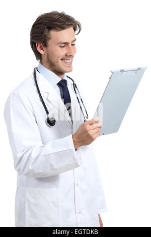 Young happy doctor man reading a medical history isolated on a white background Stock Photo