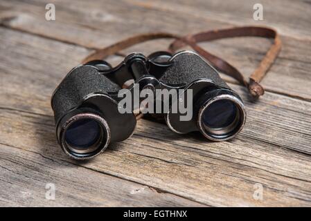 vintage binoculars on wooden background Stock Photo