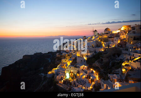 Oia village by night in Santorini island, Greece. Stock Photo