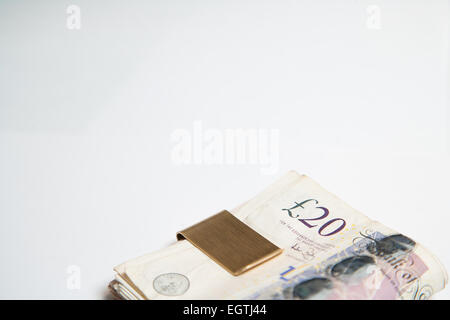 A pile of used UK Sterling Cash £20 and £10 notes Stock Photo