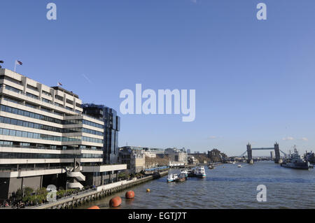 The view from London Bridge along the River Thames to the HMS Belfast and Tower Bridge London England Stock Photo