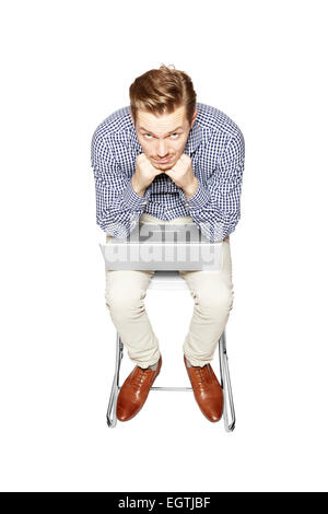 Discouraged young man Young man leaning over the keyboard. Stock Photo