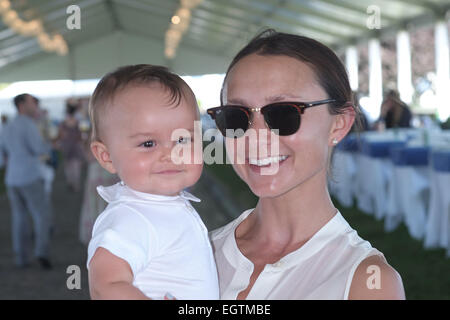 Georgina Bloomberg and son Jasper attend the Hampton Classic Horseshow Featuring: Georgina Bloomberg,Jasper Where: Bridgehampton, New York, United States When: 28 Aug 2014 Stock Photo