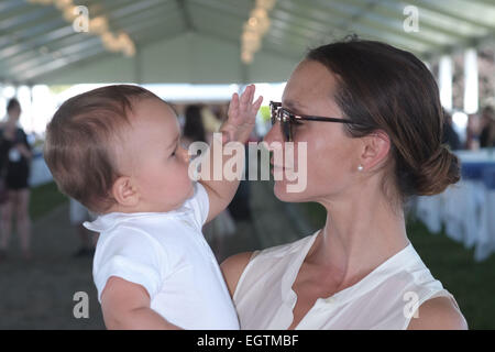 Georgina Bloomberg and son Jasper attend the Hampton Classic Horseshow Featuring: Georgina Bloomberg,Jasper Where: Bridgehampton, New York, United States When: 28 Aug 2014 Stock Photo