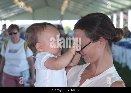 Georgina Bloomberg and son Jasper attend the Hampton Classic Horseshow Featuring: Georgina Bloomberg,Jasper Where: Bridgehampton, New York, United States When: 28 Aug 2014 Stock Photo