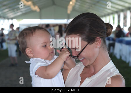 Georgina Bloomberg and son Jasper attend the Hampton Classic Horseshow Featuring: Georgina Bloomberg,Jasper Where: Bridgehampton, New York, United States When: 28 Aug 2014 Stock Photo