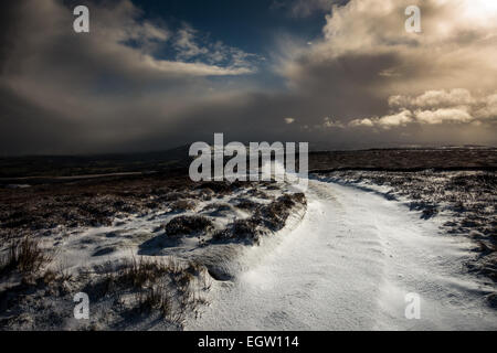 Snowy path on Ilkley moor in Yorkshire, England Stock Photo