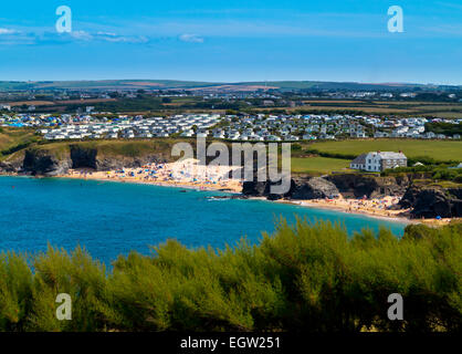 View across Mother Ivey's Bay from Trevose Head towards caravan site and crowded beach near Padstow north Cornwall England UK Stock Photo