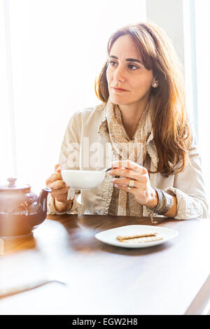 Woman having tea. Stock Photo