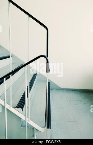 Old ugly and dirty staircase of a 1960s apartment building. Stock Photo
