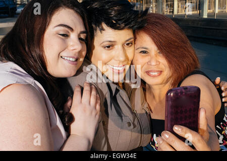 Three freinds taking a selfie.