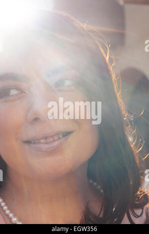 Upclose portrait of woman with pearl necklace. Stock Photo