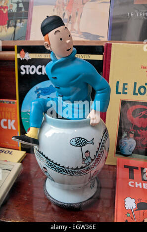 Tintin in a china pot figure souvenir in a shop window in the Galerie de la Reine, Brussels, Belgium. Stock Photo