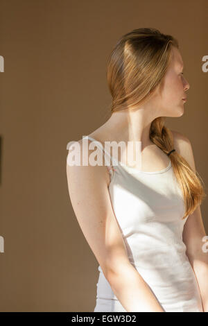 Portrait of tween/teen girl, looking to the side. Stock Photo