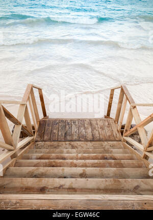 Empty wooden stairs goes down to the sea Stock Photo