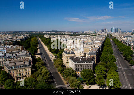 Parisienne view from top of Arc de Triomphe, looking down Avenue de la Grande Armée & Avenue Foch with La Defense in distance Stock Photo